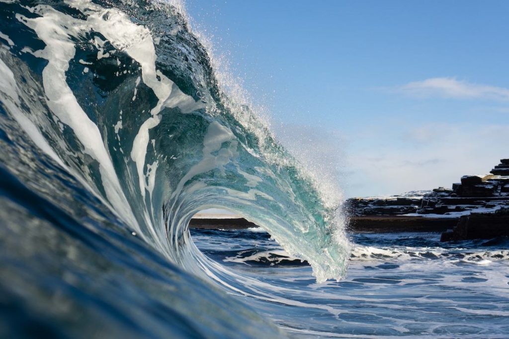 wave breaking with blue sky